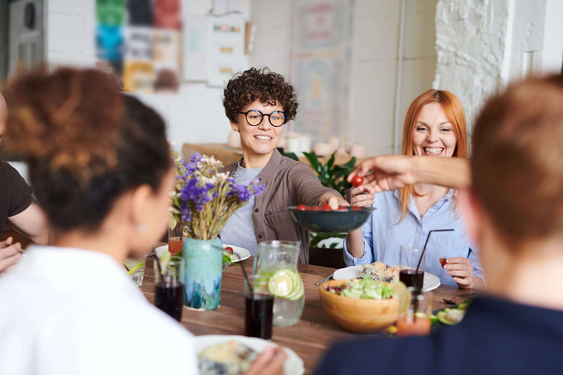 people sharing food at a table in a house, the epitome of fulfillment